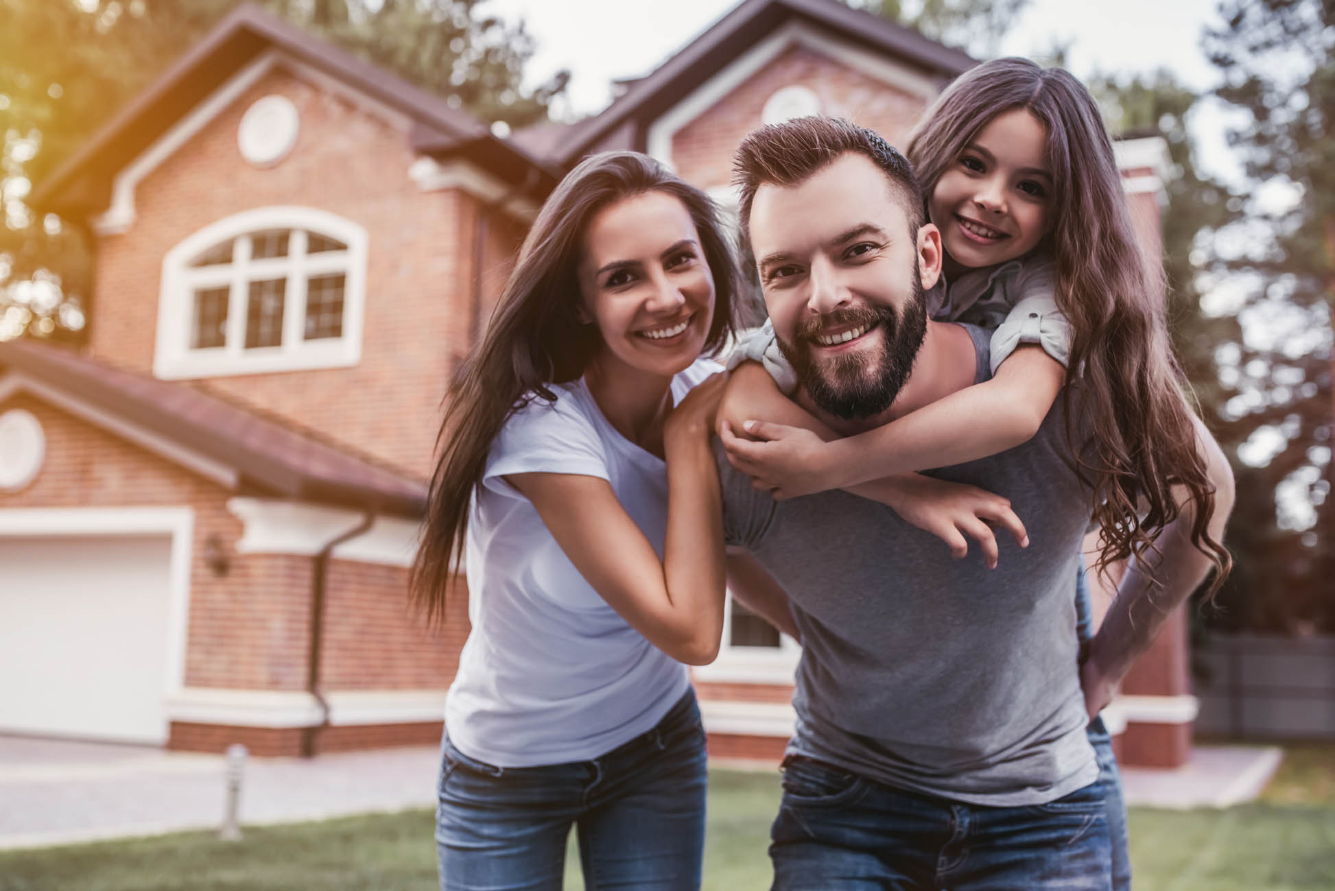 Beato Fuel and Appliance Corp Family in front of a new house